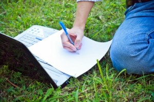 laptop and manuscript